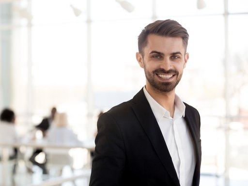 Professional headshot of business executive